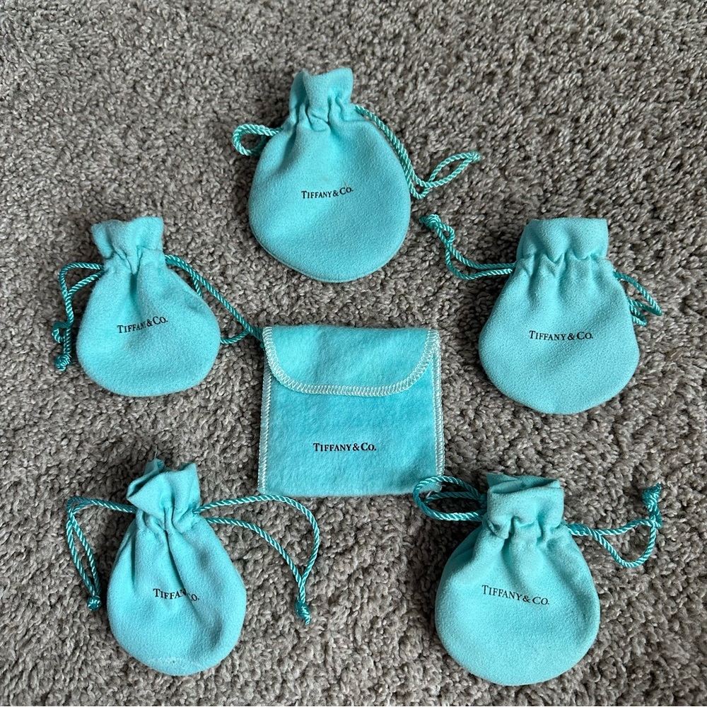 *Free w/ $18 purchase - Tiffany & Co. pouches